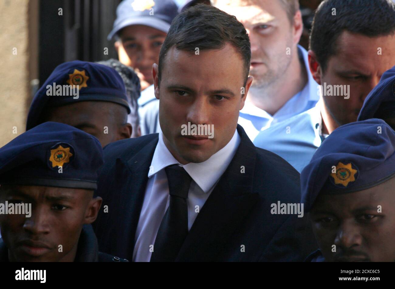 South African Olympic and Paralympic sprinter Oscar Pistorius arrives at the North Gauteng High Court in Pretoria October 21, 2014. Pistorius arrived at the court on Tuesday to be sentenced for killing his girlfriend, Reeva Steenkamp, closing one of the most sensational trials in South African history and one that may yet fuel controversy about race and money in its justice system. REUTERS/Mike Hutchings (SOUTH AFRICA - Tags: SPORT CRIME LAW ATHLETICS) Stock Photo