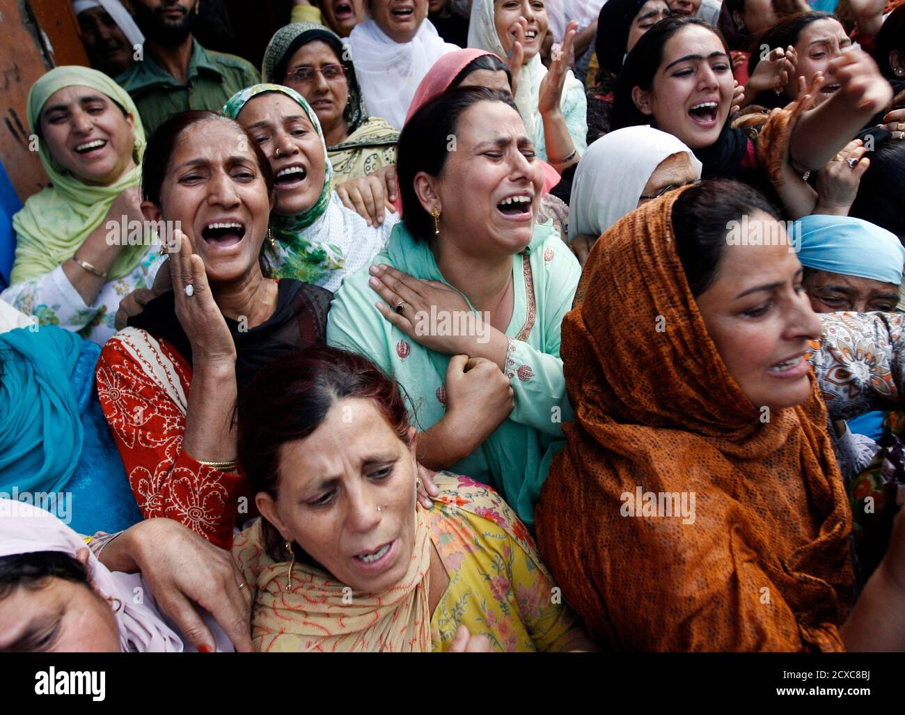 women-cry-during-the-funeral-of-a-kashmi