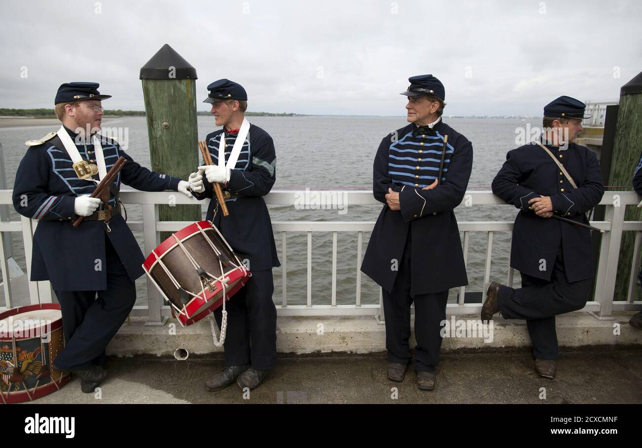 From L to R) Union soldier re-enactors Kelly Ford, Nathan Valentine, Mark  Deas Fifer and Tom Flood take a break from performing as part of a  re-enactment ceremony at Fort Sumter National