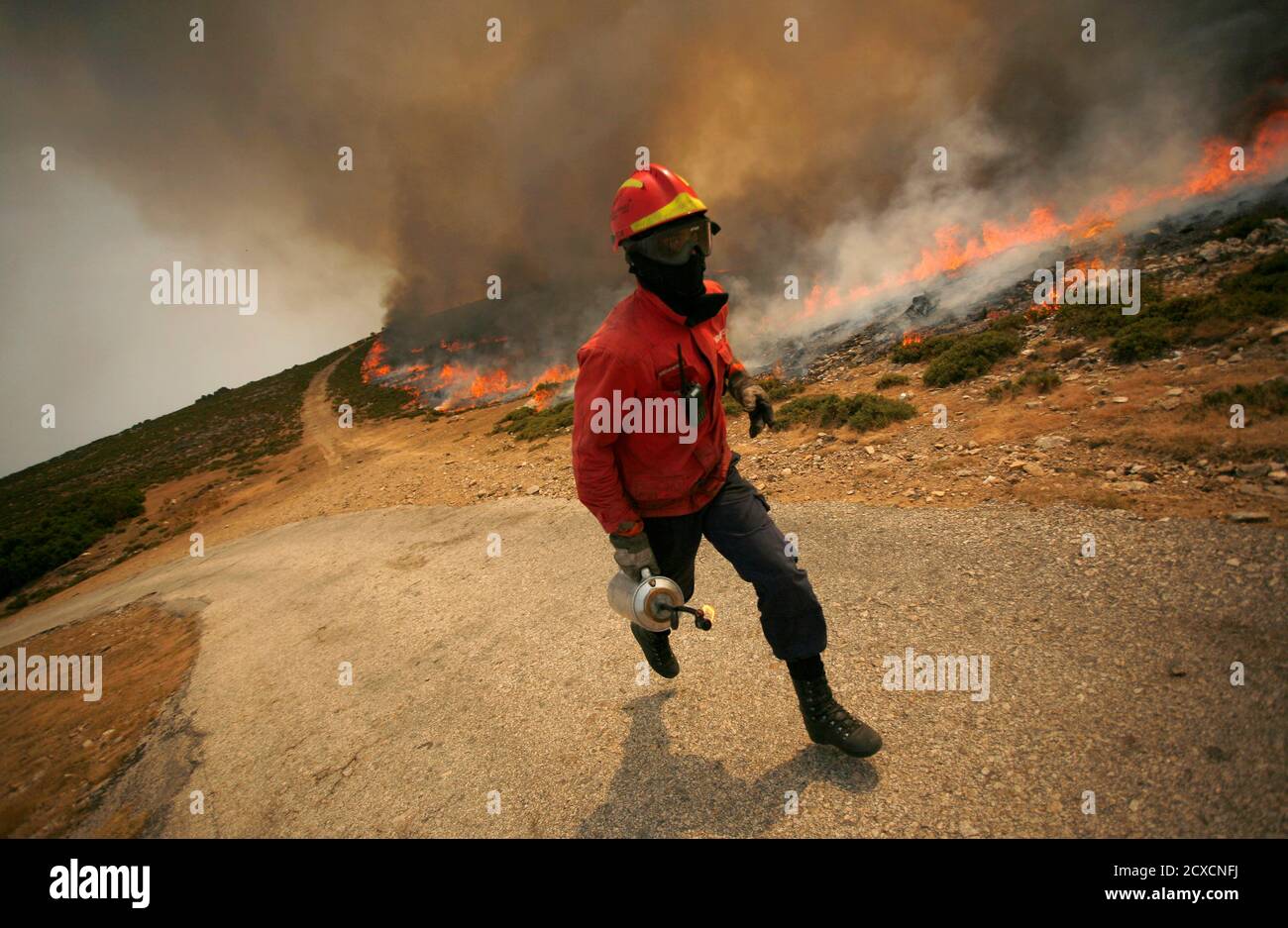 A Firefighter Runs To Extinguish A Fire Burning At Arada Mountains Near Sao Pedro Do Sul August 9 10 More Than 700 Firefighters And Soldiers Are Trying To Extinguish Dozens Of Forest A Firefighter Runs To Extinguish A Fire Burning At Arada Mountains Near Sao Pedro Do Sul August 9 10 More Than 700 Firefighters And Soldiers Are Trying To Extinguish Dozens Of Forest