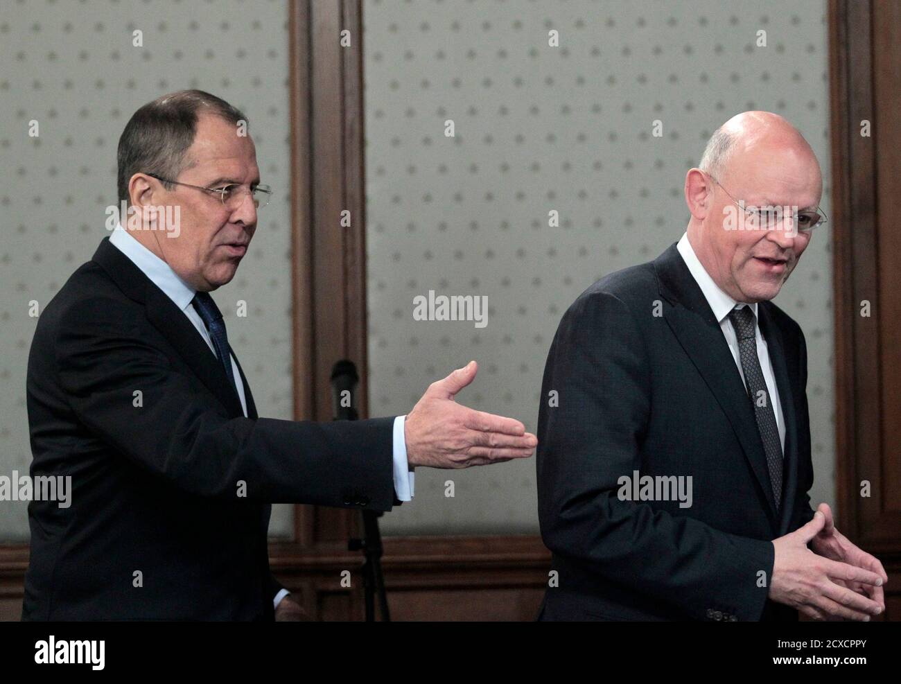 Russian Foreign Minister Sergei Lavrov (L) gestures towards his Dutch counterpart Uri Rosenthal during their meeting in Moscow March 14, 2011. Russia wants more information on the Arab League's call for a no-fly zone over Libya and will consider any proposal put before the U.N. Security Council, Lavrov said on Monday. REUTERS/Alexander Natruskin (RUSSIA - Tags: POLITICS) Stock Photo