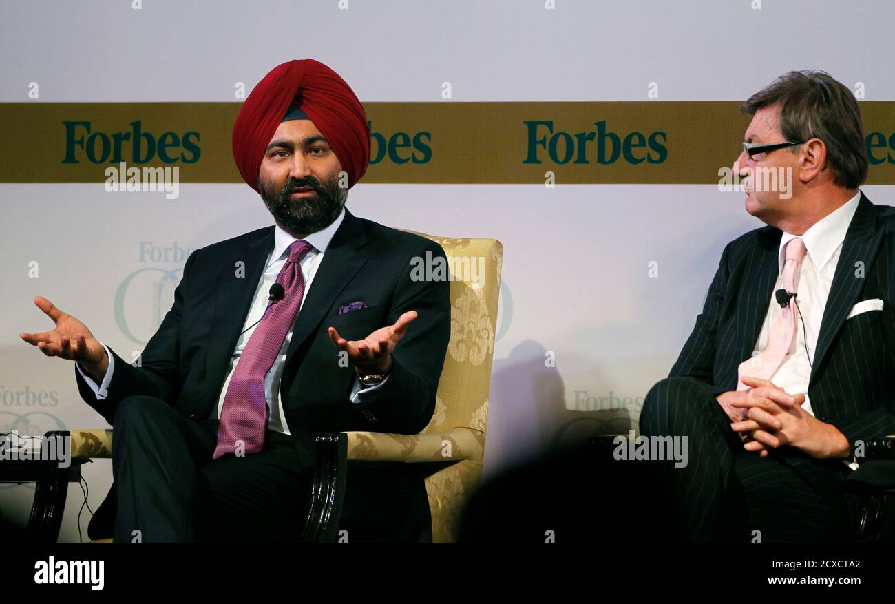 India's Fortis Healthcare Group Chairman Malvinder Mohan Singh (L) speaks  as Italy's GEOX Group Chairman Mario Moretti Polegato listens during the  Forbes Global CEO Conference in Kuala Lumpur September 13, 2011.  REUTERS/Bazuki