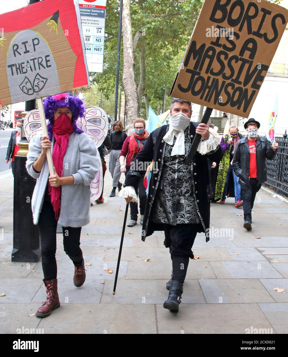 London, UK. 30th Sep, 2020. Protester in a panto costume holding a placard  against Prime Minister, Boris Johnson during the march.Pantomime Dames and  various creatives and freelancers march to Parliament in Westminster
