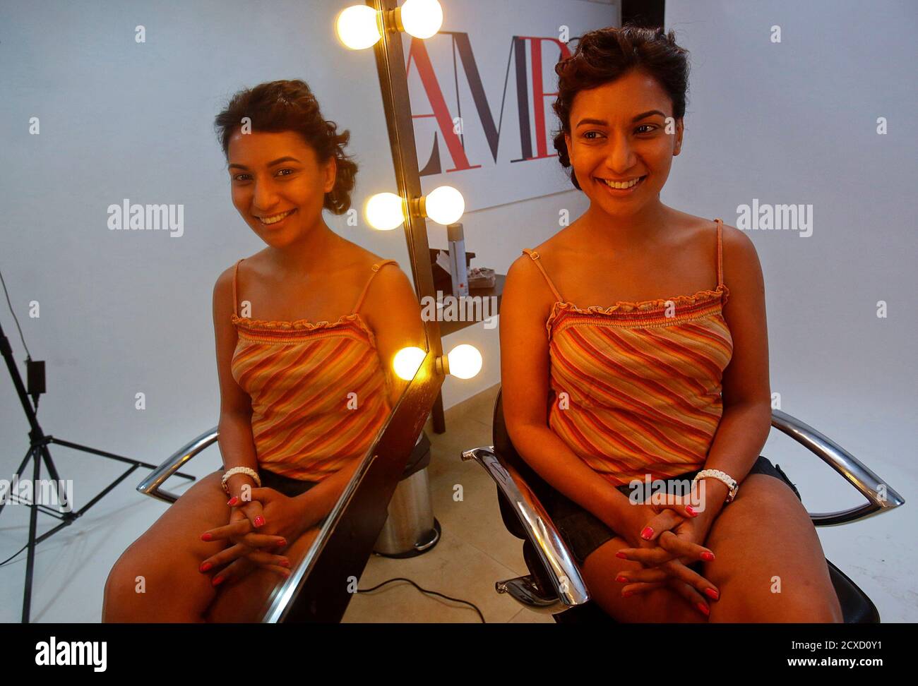 Malini Agarwal, blogger-in-chief of missmalini.com, poses for a picture as  she has her make up done before a cover photo shoot at the GLAMRS.com  magazine studio in Mumbai, January 16, 2013. Agarwal,