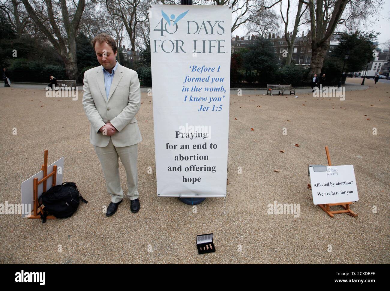An activist stands outside a branch of the British Pregnancy Advisory Service, a clinic which offers abortions, in central London March 14, 2012. The global pro-life group 40 Days for Life hits the halfway mark on Wednesday in their latest campaign. REUTERS/Andrew Winning (BRITAIN - Tags: SOCIETY HEALTH POLITICS RELIGION) Stock Photo