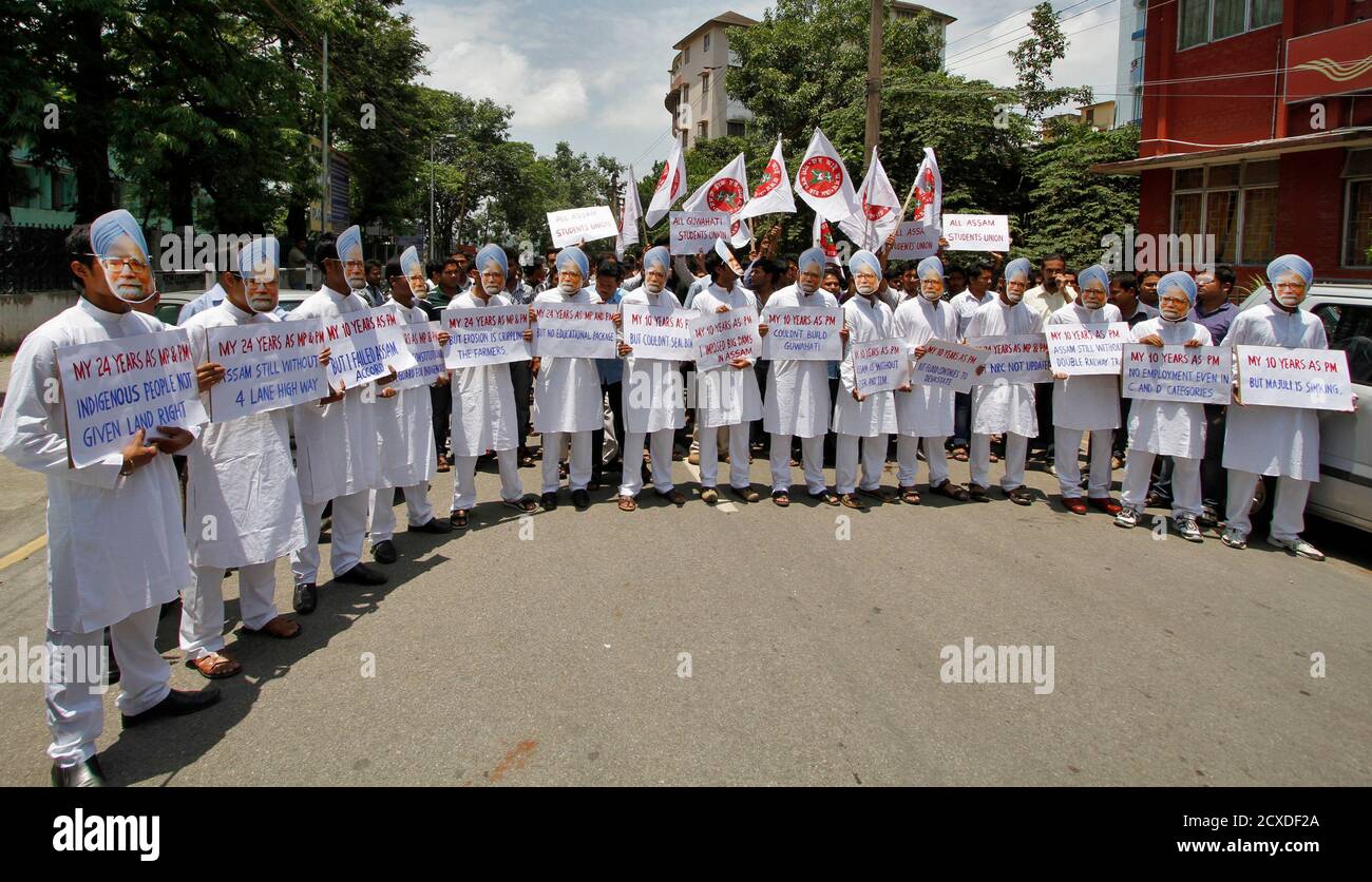 Demonstrators Wearing Masks Of India S Prime Minister Manmohan Singh Hold Placards During A Protest In Guwahati The Main City In The Northeast State Of Assam May 15 2013 Dozens Of Demonstrators On He is also famous economist. alamy