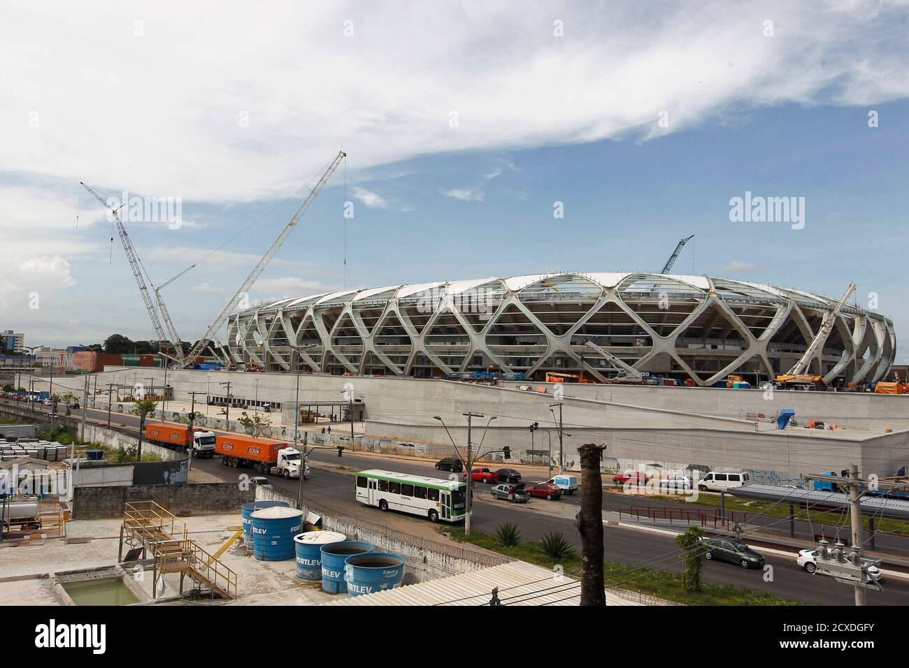 The Arena Amazonia stadium is under construction to host several 2014 World Cup soccer games, in Manaus December 14, 2013. Construction worker Marcleudo de Melo Ferreira fell to his death from the roof earlier in the day after a cable broke, adding to safety concerns as the country races to finish building in time to host the 2014 World Cup of soccer. REUTERS/Bruno Kelly (BRAZIL - Tags: SPORT SOCCER WORLD CUP DISASTER BUSINESS CONSTRUCTION) Stock Photo