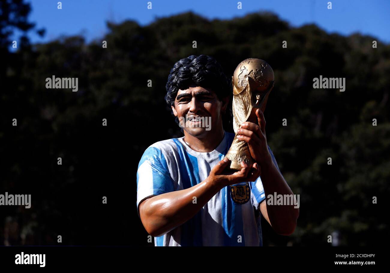 A Statue Of Former Argentine Soccer Star Diego Maradona Holding The Fifa World Cup Is Seen He was regaling local audiences by the age of 5, and became a subject for part fortunate to even have tickets to the world cup, the argentina national team are far from the image of confidence and inspiration you'd otherwise. alamy