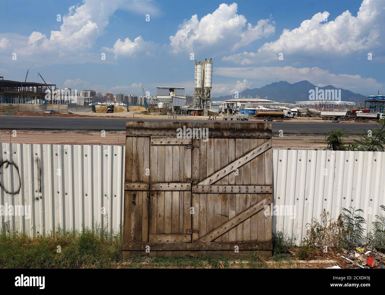 The Door Of A Demolished House Leans On The Fence Of A Construction Site For The Rio 16 Olympic Park At The Vila Autodromo Favela In Rio De Janeiro January 28 15