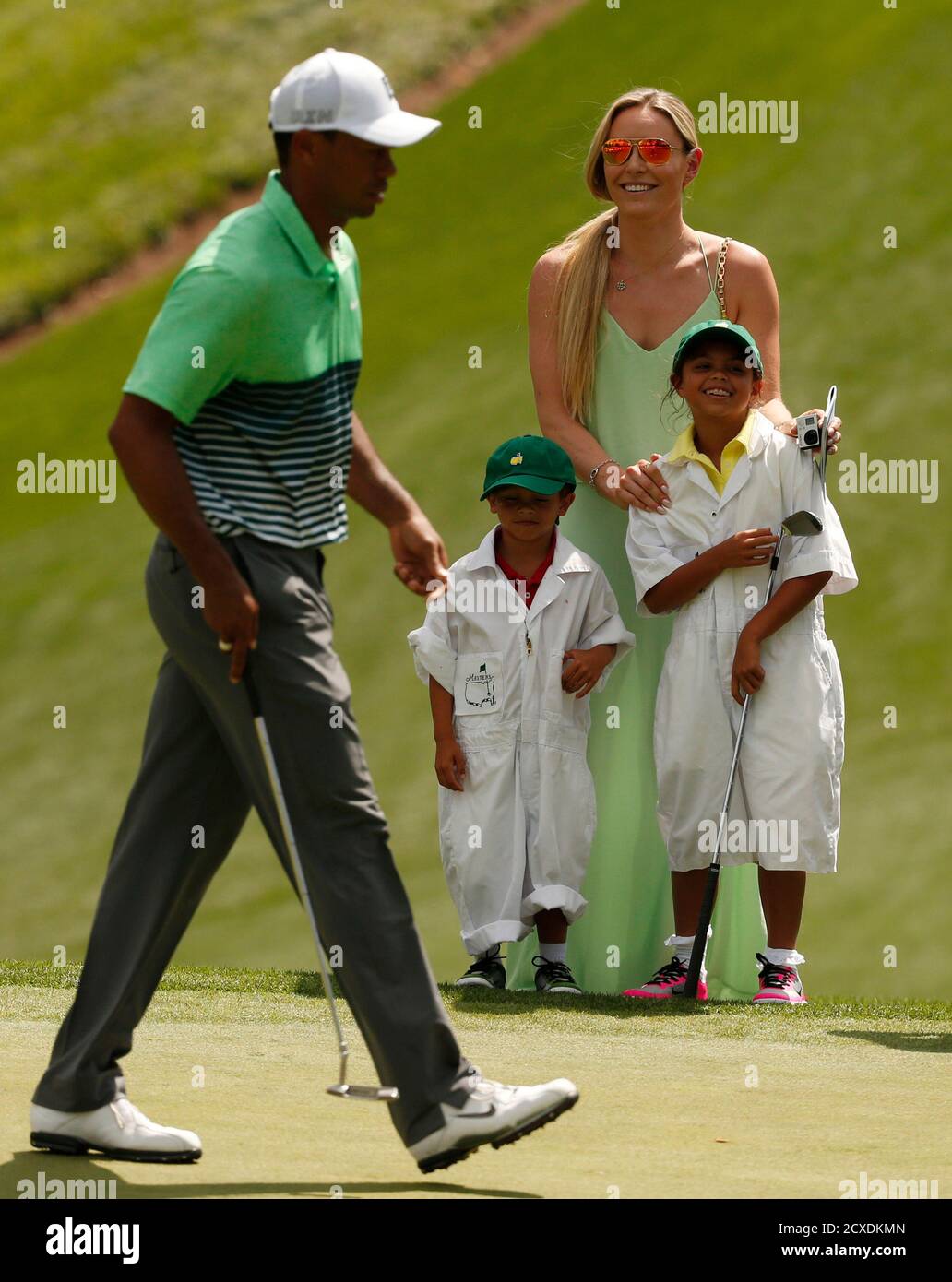 Tiger Woods Of The U S Walks On The Green As His Daughter Sam R Son Charlie And Girlfriend Lindsey Vonn Look On During The Par 3 Event Held Ahead Of The 15