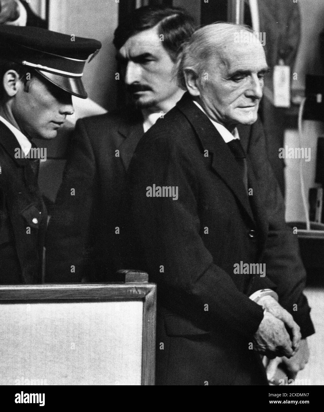 Former Nazi officer Klaus Barbie arrives handcuffed at the Lyon courthouse  May 11, 1987. Barbie was convicted of crimes against humanity and jailed  for life for his actions during World War two.