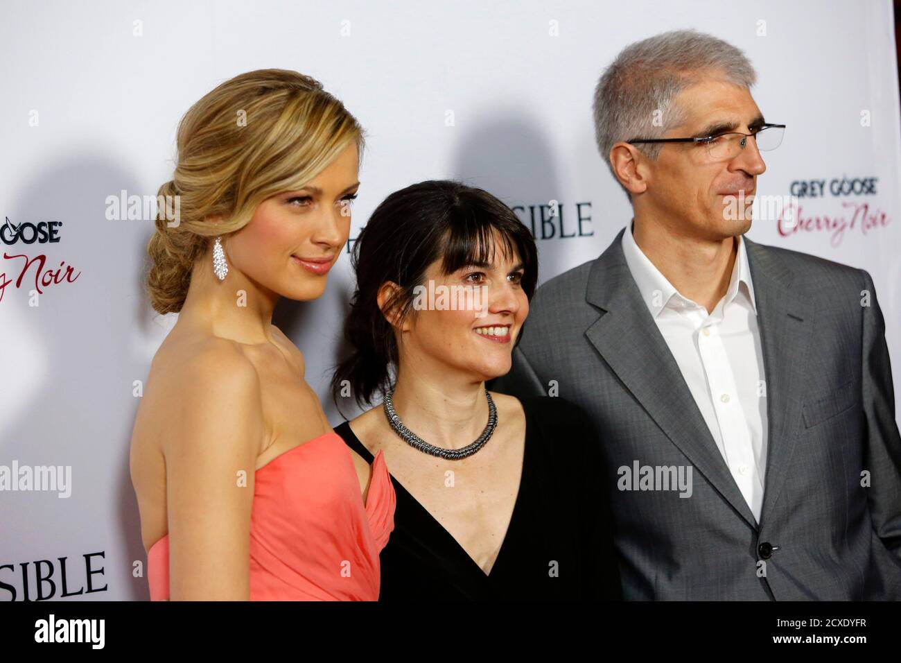 (L - R)Czech model Petra Nemcova, Maria Belon and her husband Enrique arrive at the premiere of the movie "The Impossible" at Arclight Cinema in Hollywood, California December 10, 2012. REUTERS/Patrick T. Fallon (UNITED STATES - Tags: ENTERTAINMENT) Stock Photo