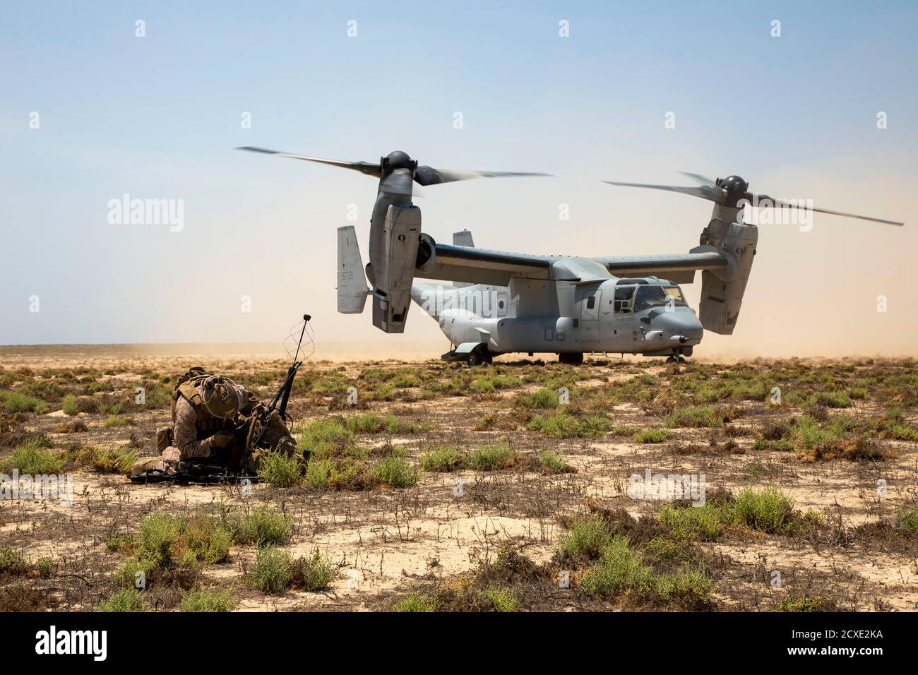 A U.S. Marine with 2nd Battalion, 5th Marine Regiment, assigned to Special Purpose Marine-Air Ground Task Force - Crisis Response - Central Command 20.2, sets up communication equipment during a Tactical Recovery of Aircraft and Personnel (TRAP) exercise on Karan Island, Kingdom of Saudi Arabia, July 13, 2020. The TRAP training prepares Marines with the knowledge and skills to recover isolated sensitive material and personnel in the event of a downed aircraft. The SPMAGTF-CR-CC is a crisis response force, prepared to deploy a variety of capabilities across the region. (U.S. Marine Corps photo Stock Photo