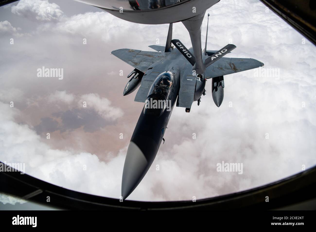 U.S. Air Force Airmen assigned to the 340th Expeditionary Air Refueling Squadron conduct aerial refueling missions aboard a U.S. Air Force KC-135 Stratotanker with a U.S. Air Force  F-15E Strike Eagle over the U.S. Central Command area of responsibility, Sept 10, 2020. The F-15E Strike Eagle is a dual-role fighter designed to perform air-to-air and air-to-ground missions, demonstrating U.S. Air Force Central Commands' posture to compete, deter, and win against state and non-state actors. (U.S. Air Force photo by Staff Sgt. Justin Parsons) Stock Photo