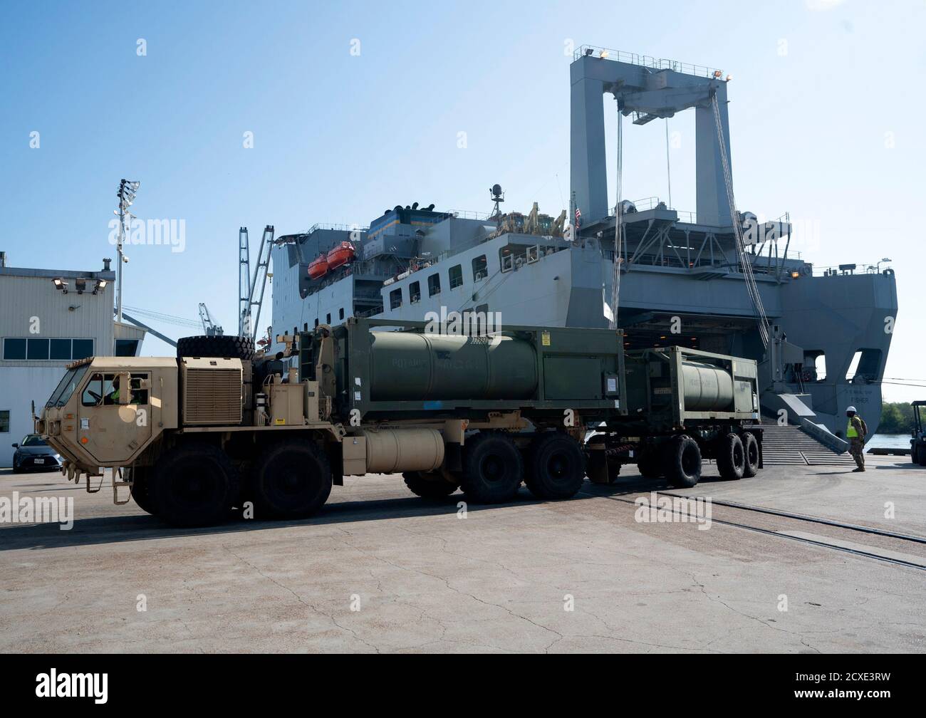 A M105 Load Handling System Compatible Water Tank Rack, (Hippo) leaves the Large, Medium- Speed, Roll-on/Roll-off Fisher ship after a download of cargo during the Joint Readiness Exercise 20, at the Port of Port Arthur, Texas, Sept. 26, 2020. The exercise assessed units’ ability to respond to a published deployment order, how quickly and accurately they could prepare cargo for deployment, and how well they coordinated their arrival to the seaport. (USTRANSCOM photo by Michelle Gigante) Stock Photo