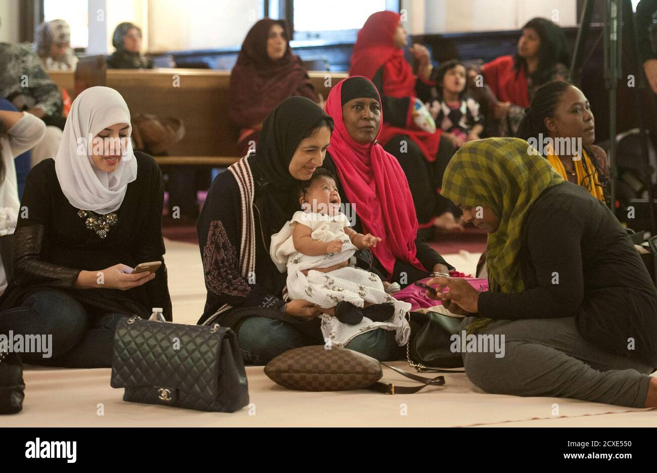 Women wait for the prayer service at the Women's Mosque of America in downtown Los Angeles, California January 30, 2015. The first mosque in the United States to be solely dedicated to women launched with a women-led prayer service. REUTERS/Lori Shepler (UNITED STATES - Tags: RELIGION SOCIETY) Stock Photo