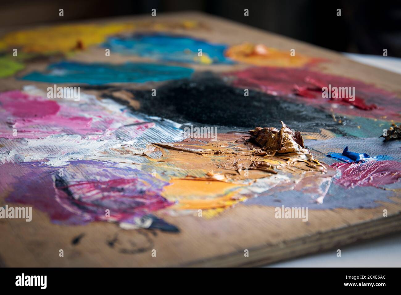 Artist's color palette. Dried oil paint. Creativity and art Stock Photo