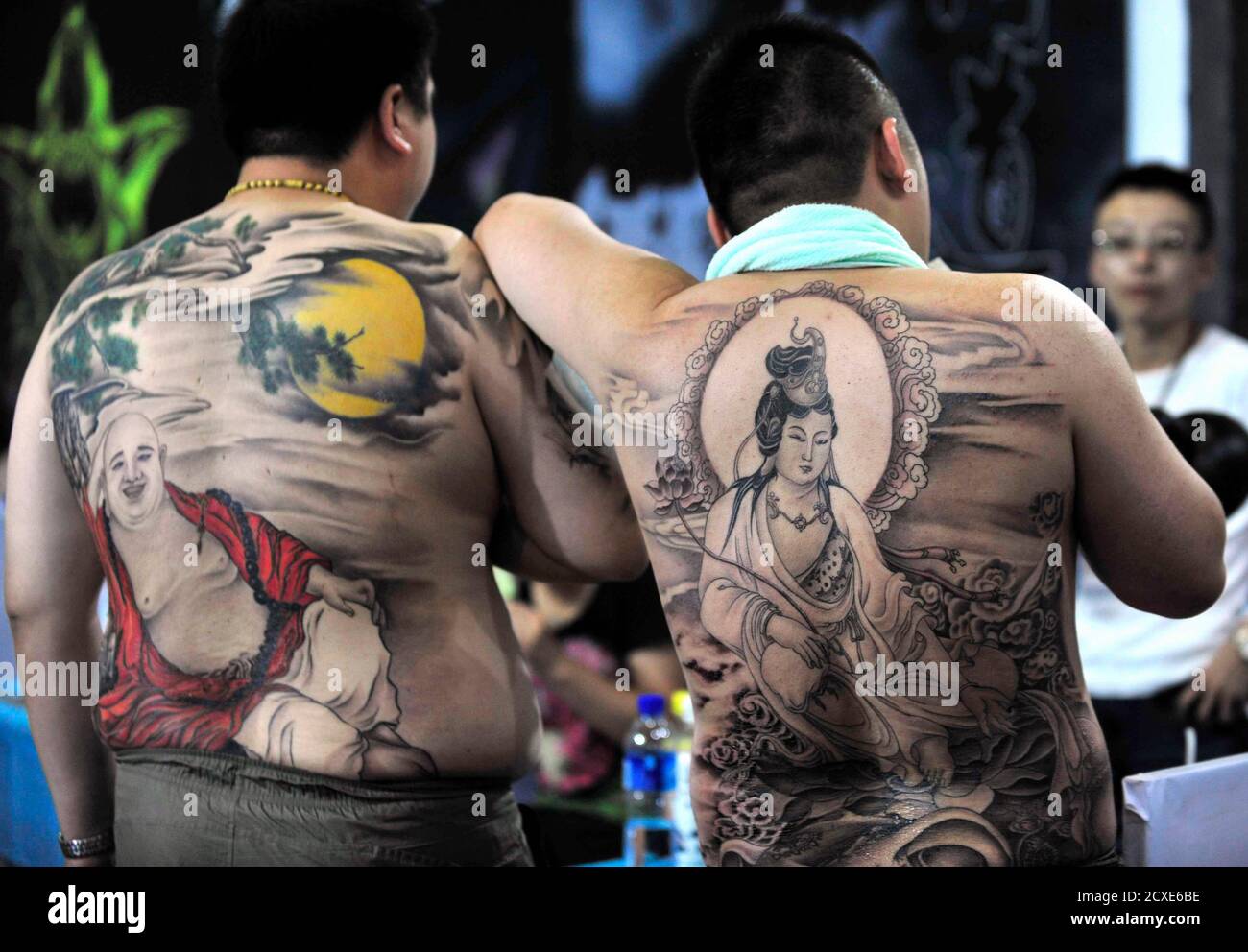 Models display tattoos at the National Tattoo Competition in Shenyang,  Liaoning province August 6, 2010. Some 100 tattoo artists from all over the  nation compete in 