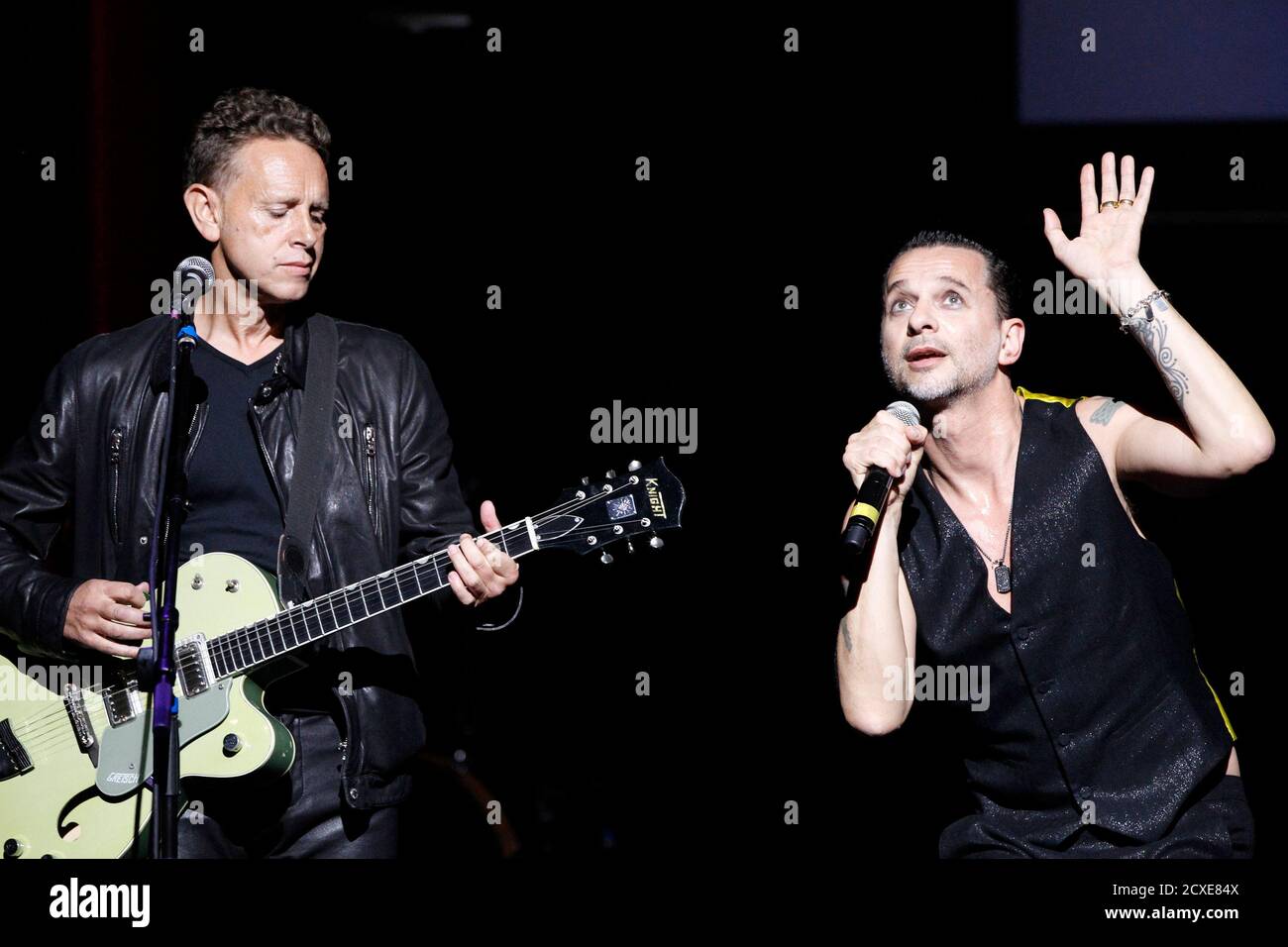 Dave Gahan (R) and Martin Gore of British band Depeche Mode perform "Reach  out and touch me" during the 7th Annual MusiCares MAP Fund Benefit concert  in Los Angeles May 6, 2011.