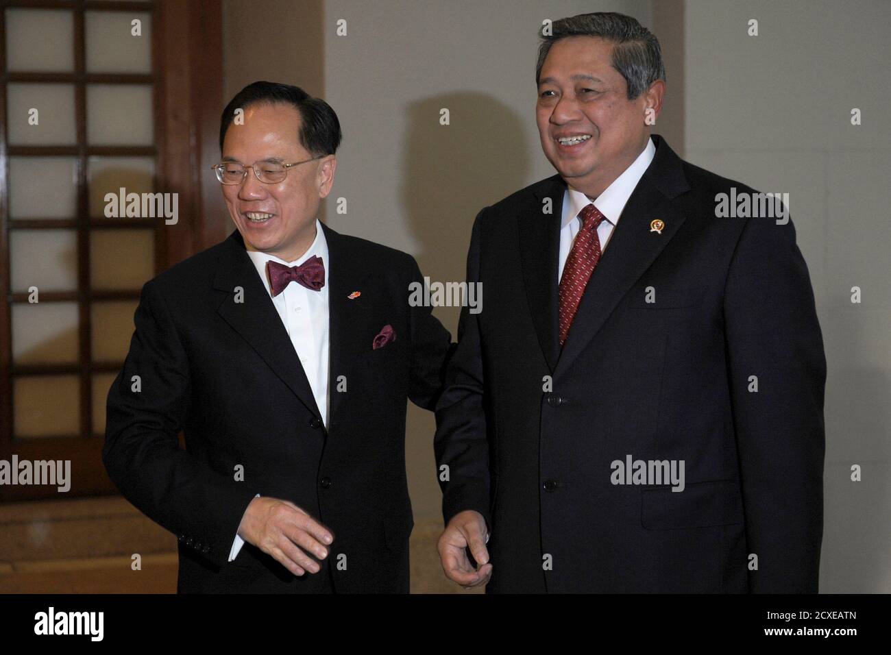 Hong Kong S Chief Executive Donald Tsang L Leads Indonesian President Susilo Bambang Yudhoyono Into The Government House In Hong Kong March 24 2012 President Yudhoyono Is On A Two Day Visit To Hong<script async src=