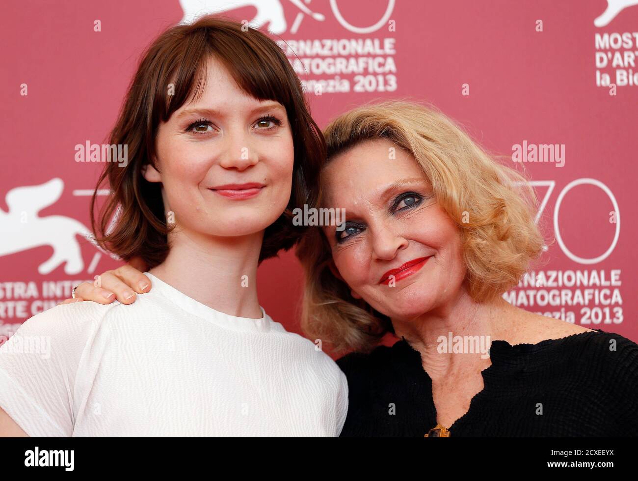 Actress Mia Wasikowska (L) and author of novel Australian Robyn Davidson (R) pose during a photocall during the 70th Venice Festival in Venice August 29, 2013. Wasikowska star