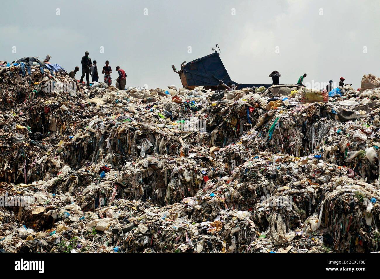 Birds fly over a heap of rubbish at Olusosun waste dump site in Ojota  district in Lagos October 10, 2013. One thing Nigeria's megacity of Lagos,  one of the world's largest, generates