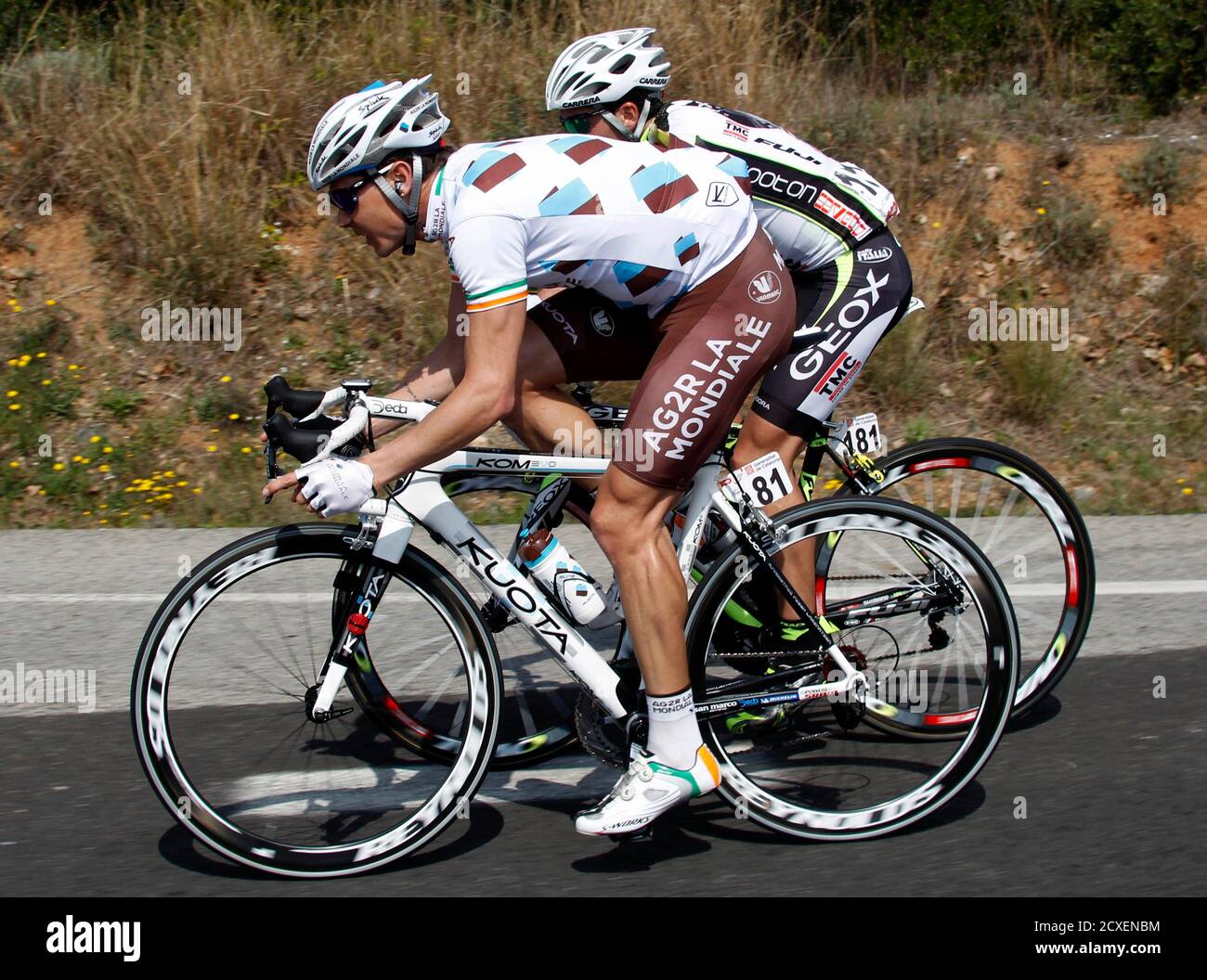 Ag2r's cyclist Nicolas Roche (L) of Ireland rides near Geox-Tmc's Carlos  Sastre of Spain during the 195 km fifth stage at the Tour of Catalunya  cycling race in Tarragona March 25, 2011.