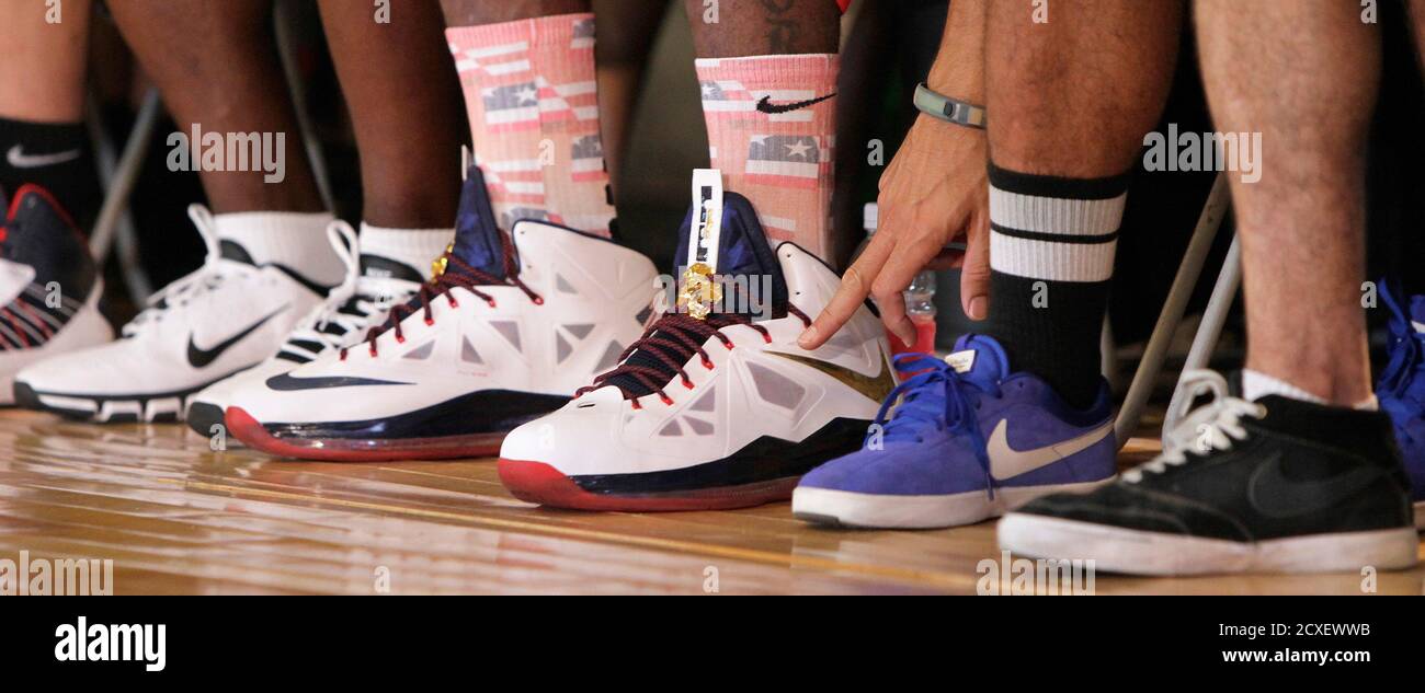 A pair of the the Lebron X basketball shoes (C) are seen on the Miami Heat  star, LeBron James, during a promotional event in Shanghai, August 24,  2012. The Wall Street Journal