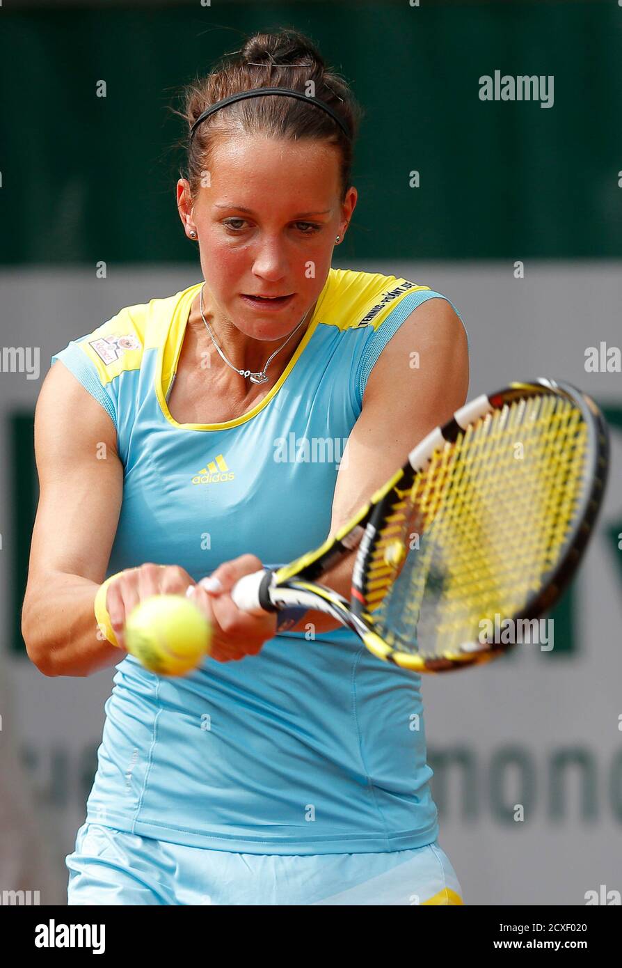 Dinah Pfizenmaier of Germany hits a return to Mandy Minella of Luxembourg  during their women's singles match at the French Open tennis tournament at  the Roland Garros stadium in Paris May 26,