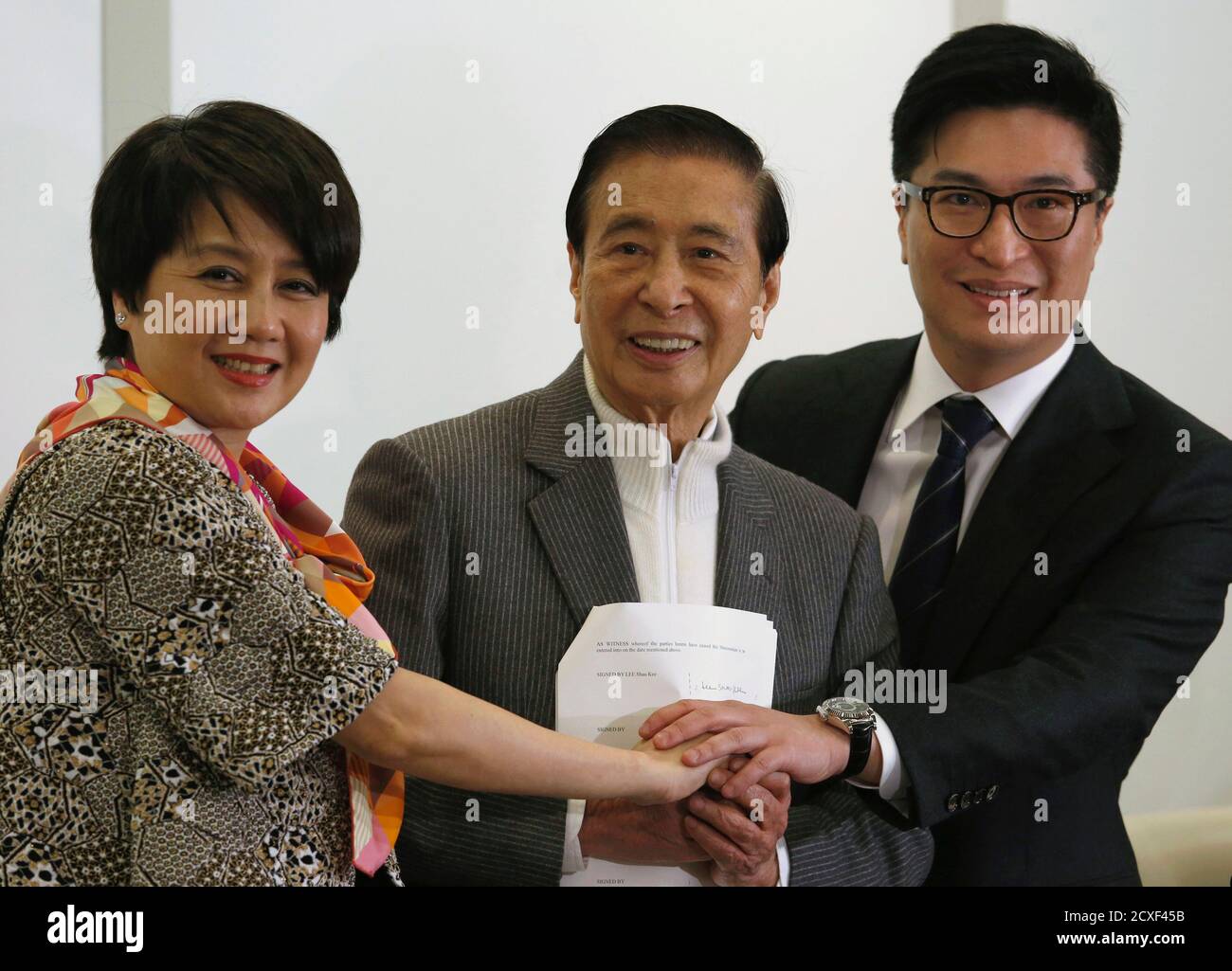 Tycoon Lee Shau-kee (C), 86, founder, Chairman and Managing Director of  property conglomerate Henderson Land Development Company Limited, his son  and Vice-Chairman Martin Lee (R), and Angela Leong, wife of Macau tycoon