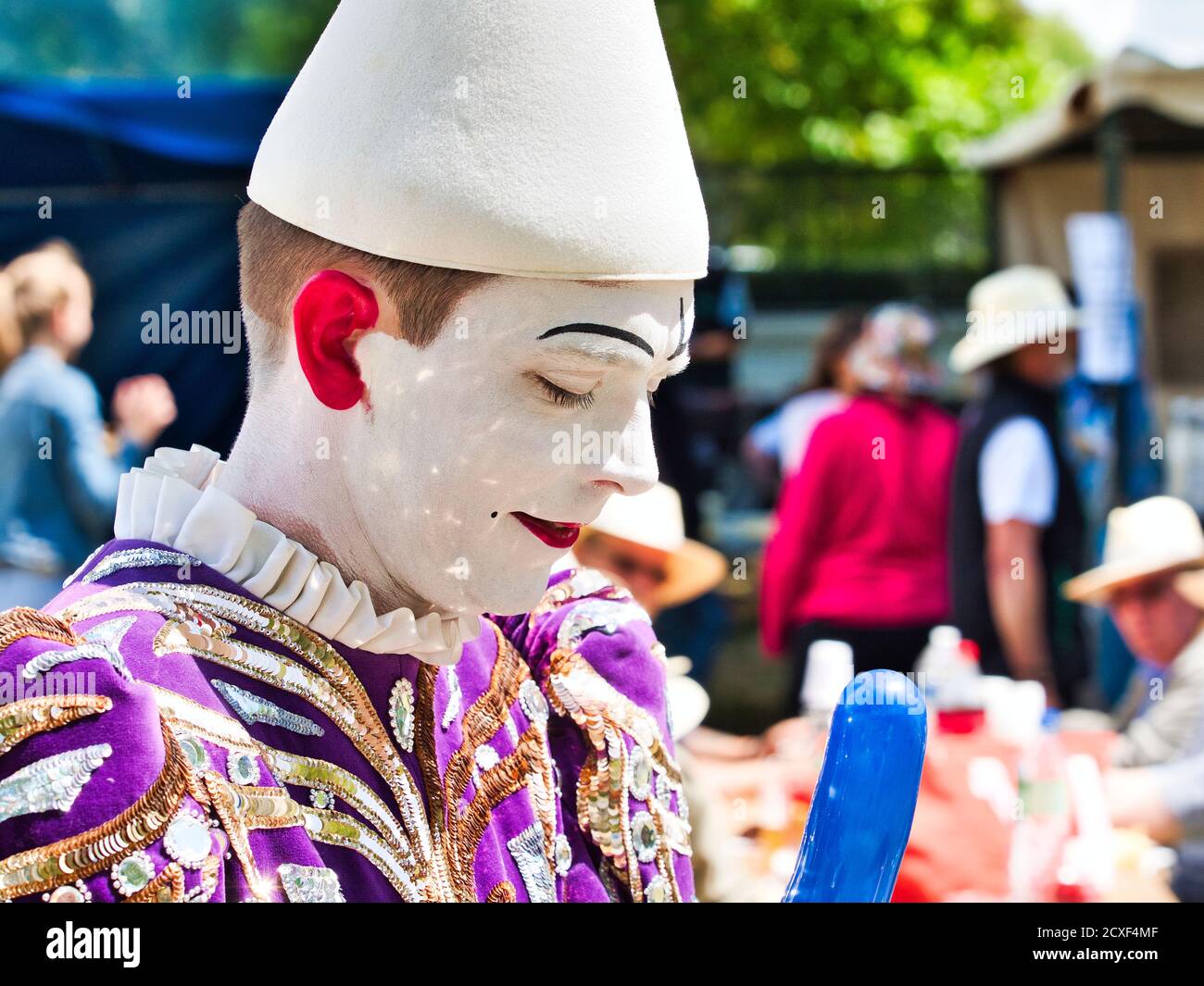 YAINVILLE, FRANCE - JULY Circa, 2019. Unidentified sad face headshot pierrot actor at the spectacle for Armada parade Stock Photo