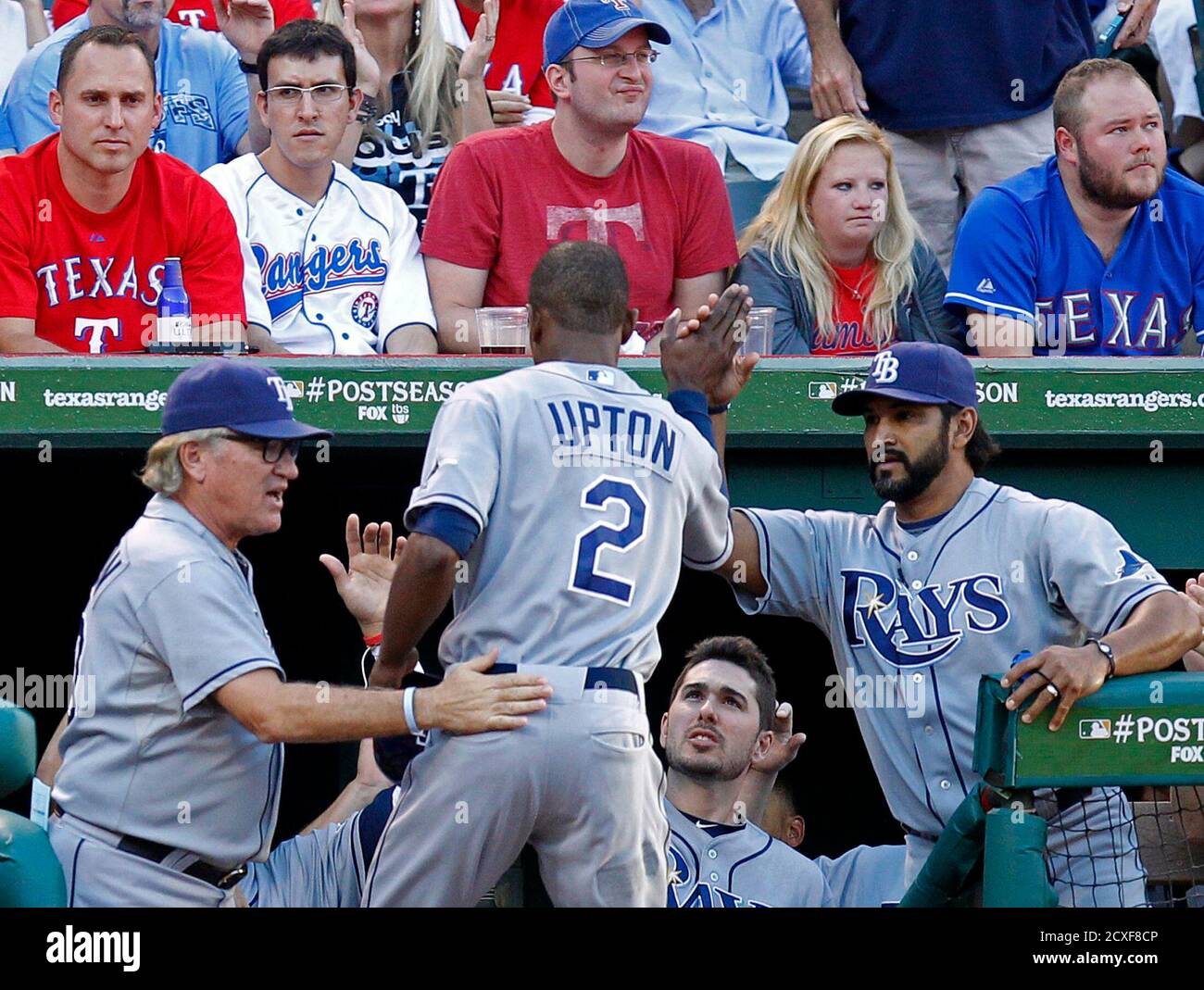 Tampa Bay Rays Manager Joe Maddon L Congratulates B J Upton C After He Was Walked In To Score By Texas Rangers Starting Pitcher Derek Holland With Bench Coach Dave Martinez At Right