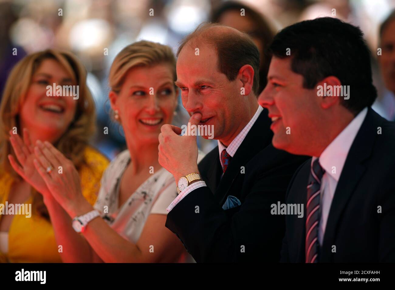 britains-prince-edward-2nd-r-his-wife-countess-of-wessex-sophie-rhys-jones-2nd-l-gibraltar-prime-minister-fabian-picardo-r-and-his-wife-justine-smile-as-they-watch-a-performance-by-the-gibraltar-academy-of-dance-in-downtown-gibraltar-june-11-2012-the-youngest-son-of-queen-elizabeth-ii-prince-edward-and-his-wife-started-the-visit-to-gibraltar-on-monday-to-take-part-in-celebrations-for-queen-elizabeths-diamond-jubilee-a-journey-that-has-bothered-the-spanish-government-after-recent-incidents-with-fishermen-in-the-area-reutersjon-nazca-gibraltar-tags-royals-society-politics-2CXFAHH.jpg