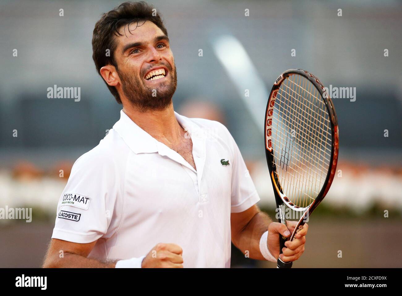 Pablo Andujar of Spain celebrates his victory against Kei Nishikori of  Japan at the end of their men's singles quarterfinal match at the Madrid  Open tennis tournament, May 10, 2013. REUTERS/Juan Medina (