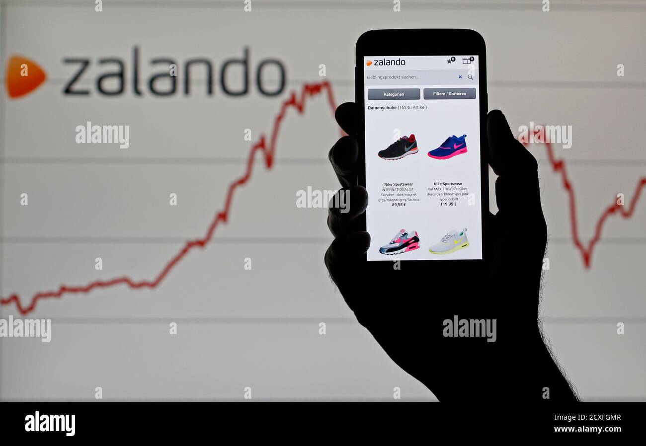 A Samsung Galaxy S5 with an open Zalando web page is pictured in front of a  Zalando logo and graph in this illustration taken in Sarajevo, September 9,  2014. Shares in Europe's
