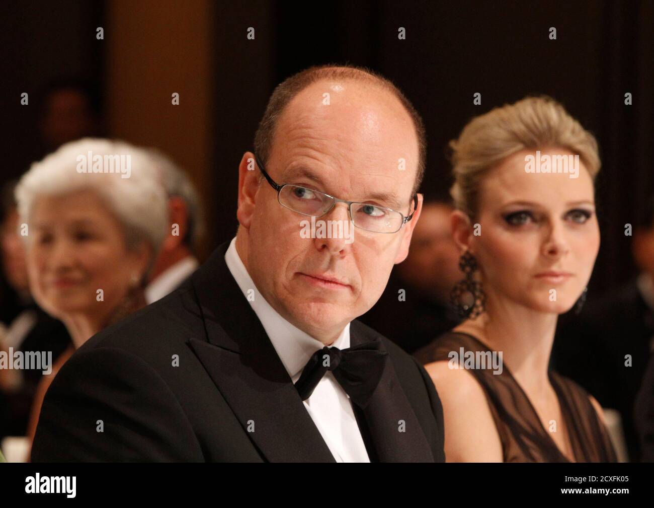 Monaco's Prince Albert II (L) and his fiancee Charlene Wittstock attend at a gala dinner hosted by BirdLife International in Tokyo October 29, 2010. REUTERS/Issei Kato (JAPAN - Tags: ROYALS SOCIETY) Stock Photo