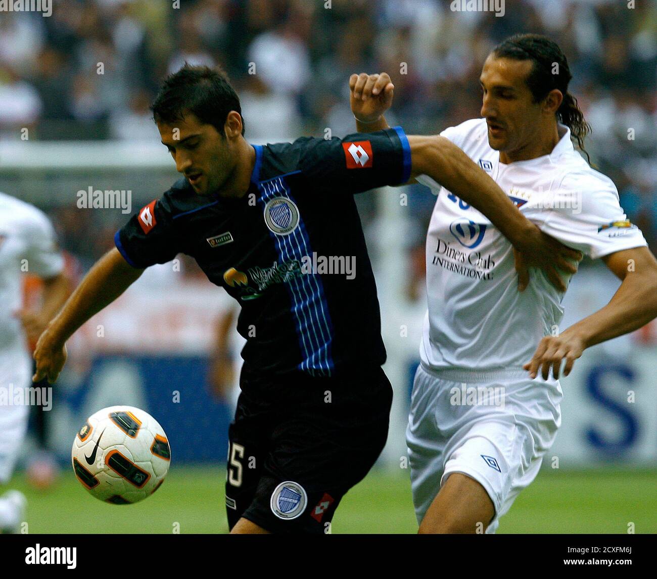 Nicolas Sanchez L Of Argentina S Godoy Cruz Battles For The Ball With Hernan Barcos Of Ecuador S Ldu During Their Copa Libertadores Soccer Match At The Casa Blanca Stadium In Quito April 12