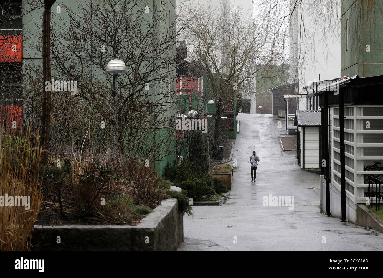 A Man Walks In The Husby Suburb Of Stockholm April 7 2014 In Stockholm S Suburb Of Husby The Roads Still Bear Charred Marks From Cars Torched In Sweden S Worst Riots For Years