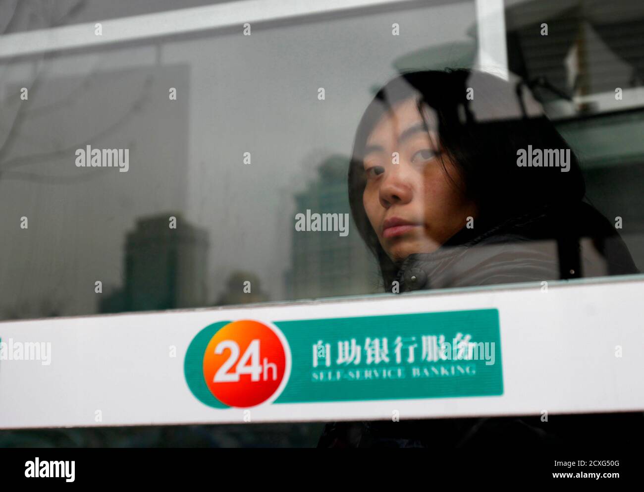 https www alamy com a woman waits inside an atm machine booth at a local bank in downtown shanghai january 17 2011 chinas average consumer price rises will be around 4 percent in 2011 but inflation will not be malicious yao jingyuan chief economist at the national statistics bureau said in remarks published on monday reuterscarlos barria china tags business society image377753952 html