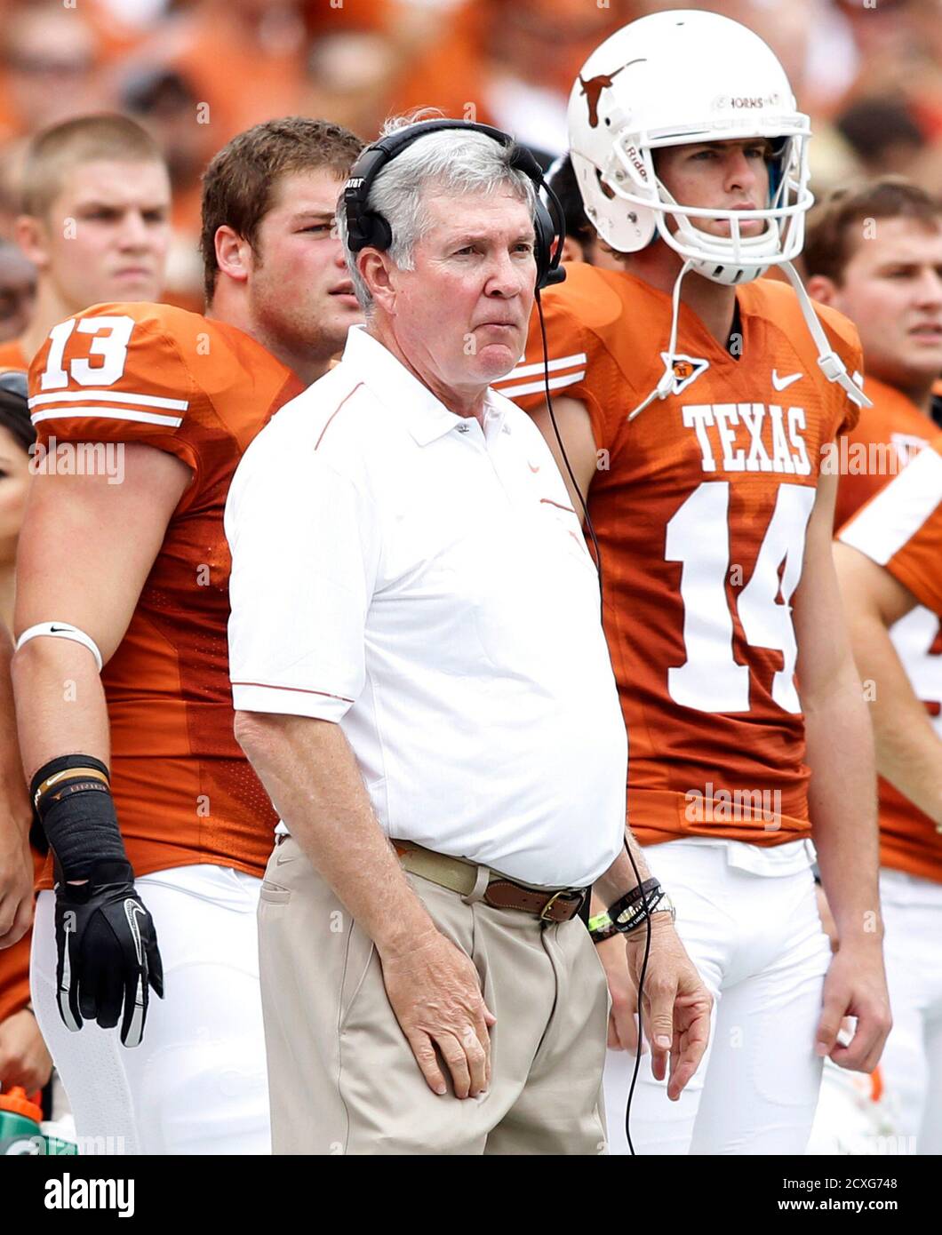University of Texas head coach Mack Brown (L) and quarterback David Ash  watch from the sideline against the University of Oklahoma in the first  half of their NCAA Big 12 football game