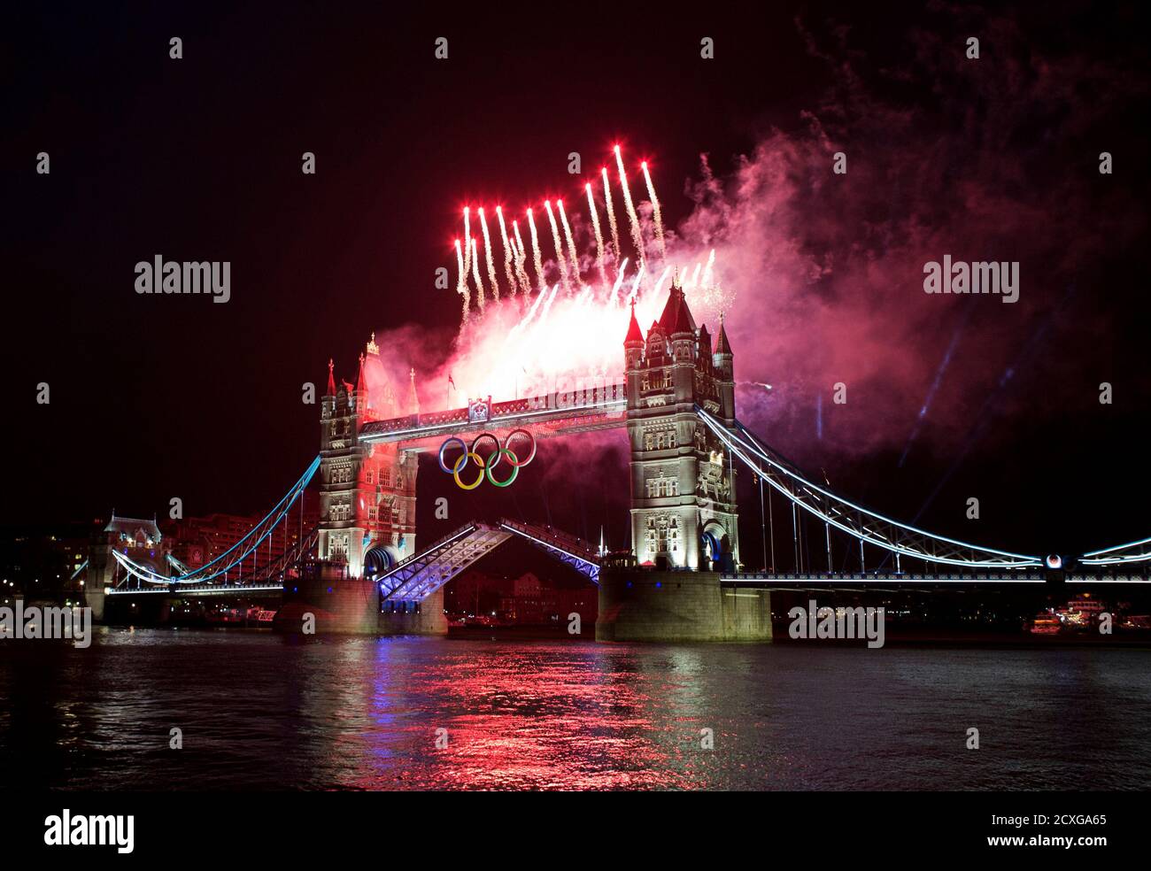 Fireworks explode over the London Tower Bridge during the opening ceremony of London 2012 Olympic Games July 27, 2012. REUTERS/Mark Blinch (BRITAIN - Tags: SPORT OLYMPICS) Stock Photo
