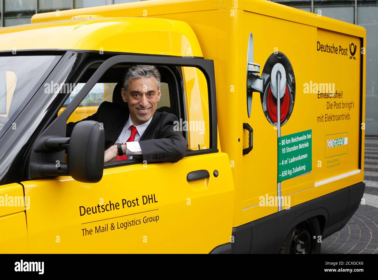 Frank Appel, CEO of German postal and logistics group Deutsche Post DHL  looks out of a StreetScooter E-car in Bonn May 21, 2013. DHL on Tuesday  introduced their pilot electrical car project
