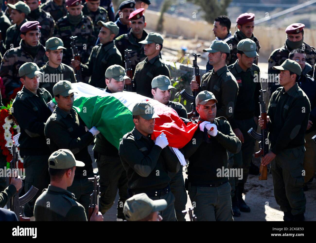 Palestinian National Security Guards Carry The Flag Covered Body Of Palestinian Ambassador To Prague Jamal Al Jamal During His Funeral In The West Bank City Of Ramallah January 8 14 Al Jamal Died On January