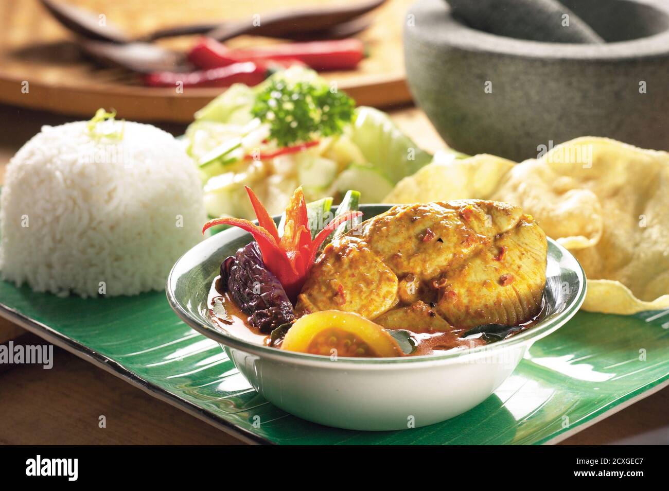 Traditional Indian dish of fish curry with okra and eggplant Stock