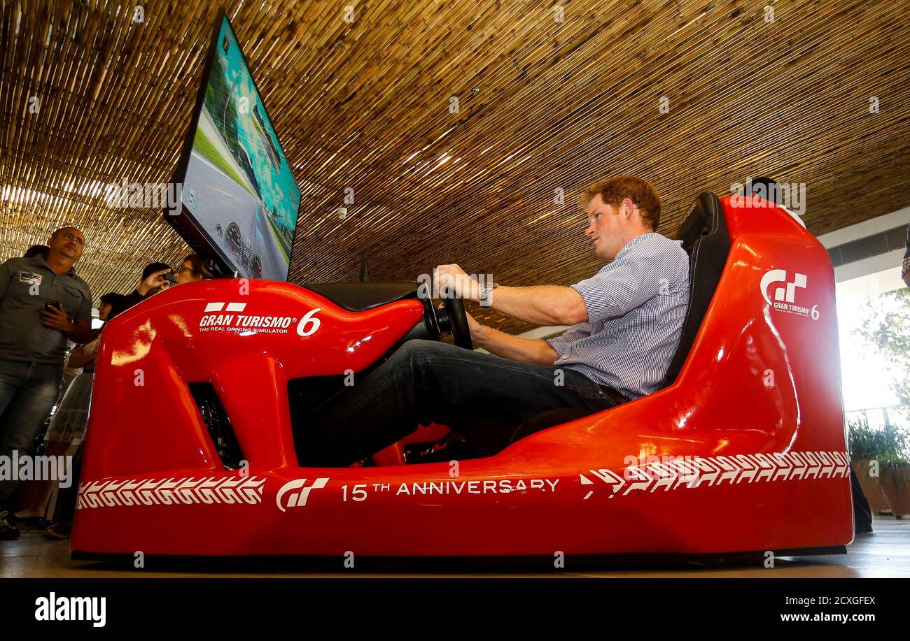 Britain's Prince Harry drives a Formula One simulator during a visit to the Ayrton Senna Institute in Sao Paulo, June 26, 2014 .    REUTERS/Pool/Miguel Schincariol (BRAZIL  - Tags: SPORT MOTORSPORT ROYALS SPORT MOTORSPORT F1 POLITICS) Stock Photo