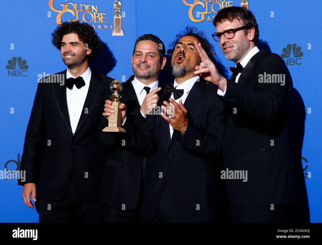 Armando Bo (L), Alexander Dinelaris, Jr., director Alejandro Gonzalez  Inarritu and Nicolas Giacobone (R) pose with their award for Best  Screenplay - Motion Picture for their film "Birdman" backstage at the 72nd