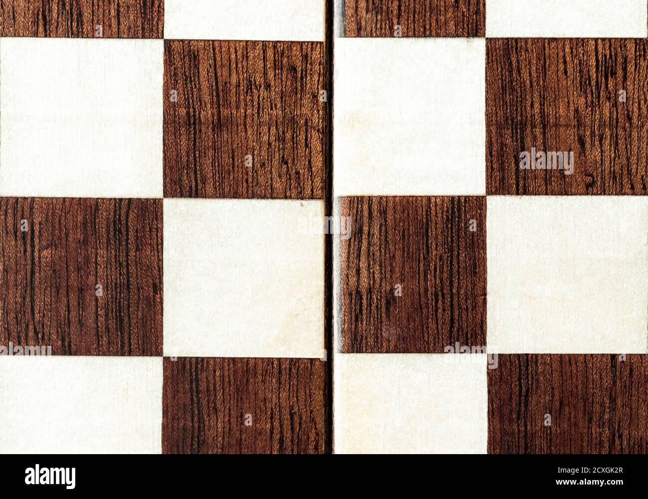 A fragment of a handmade lacquered chessboard. Stock Photo