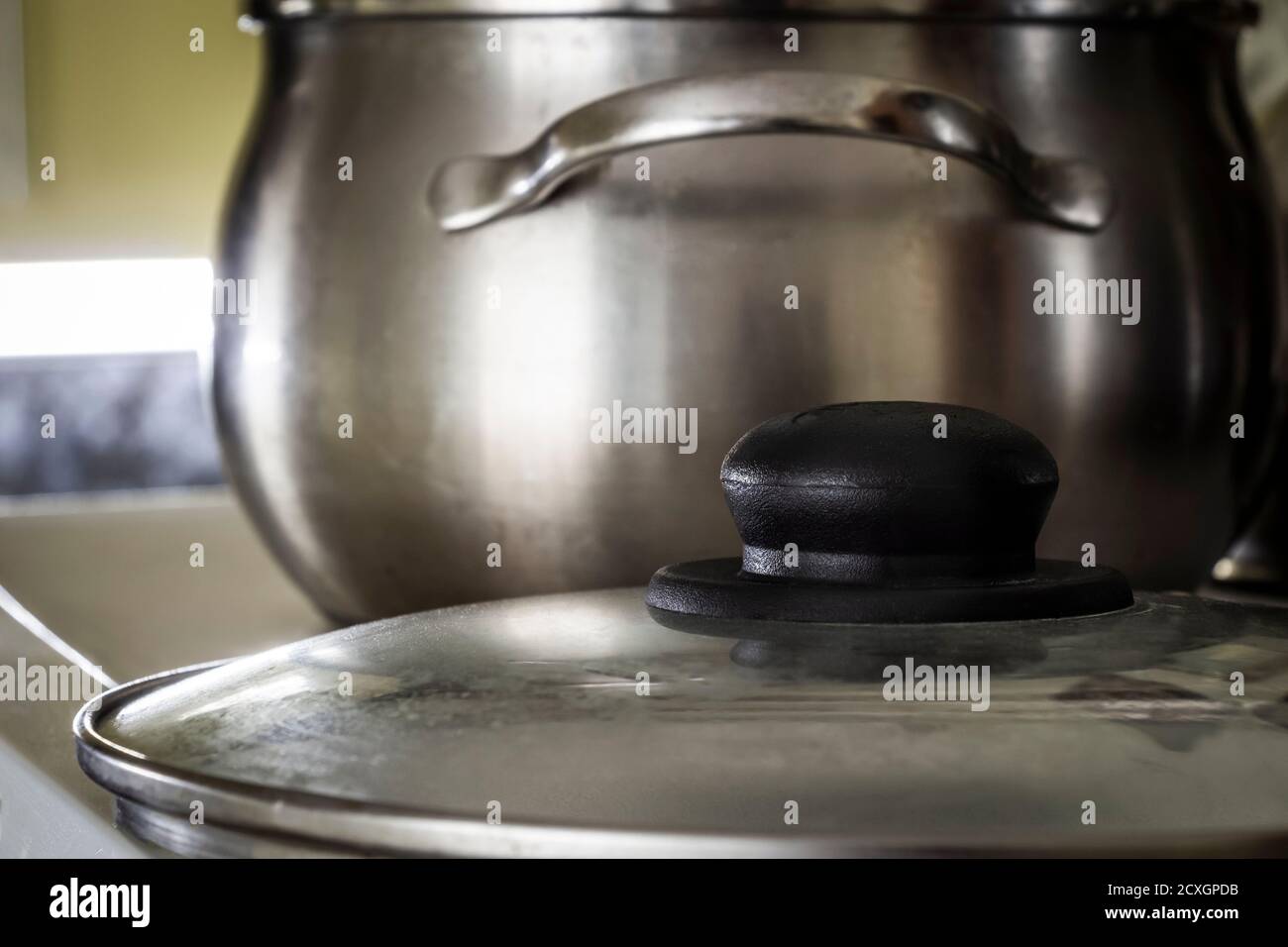 https://c8.alamy.com/comp/2CXGPDB/shiny-stainless-steel-saucepan-on-the-kitchen-sink-2CXGPDB.jpg