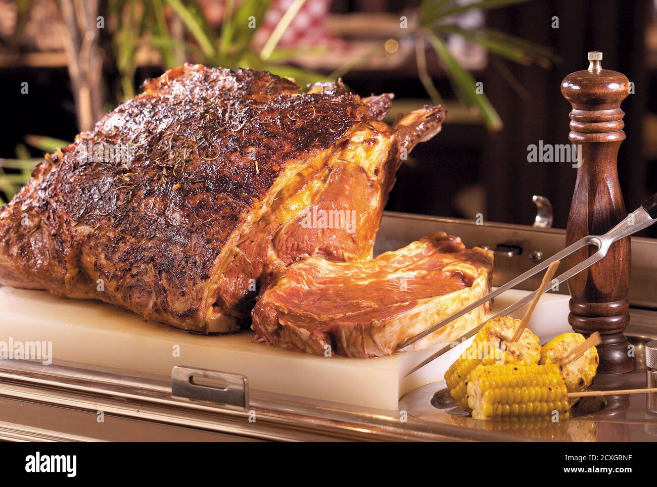Delicious roasted meat served on a cutting board Stock Photo