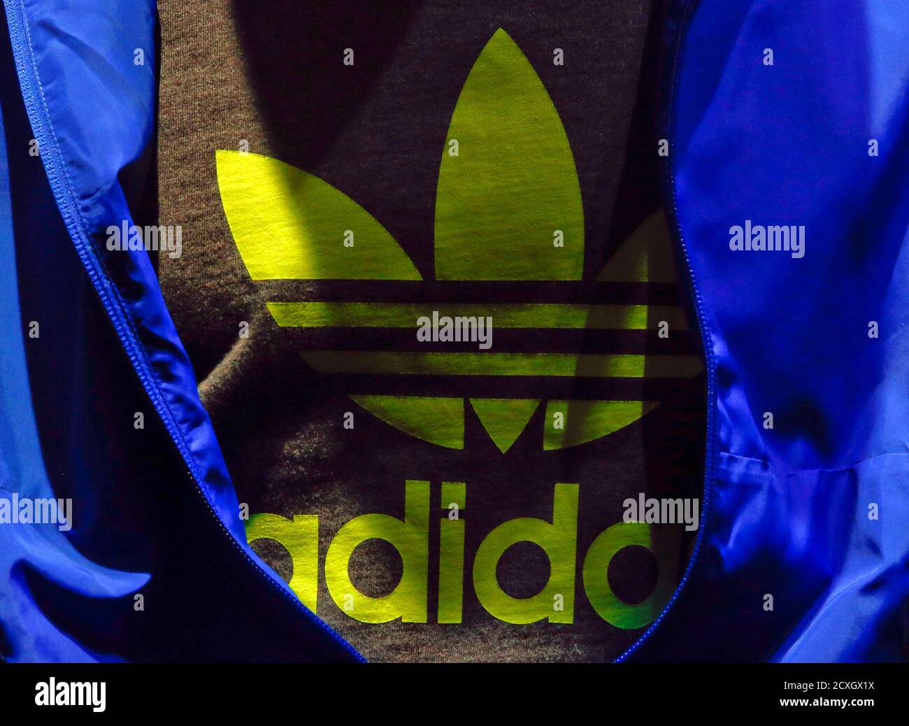 The Adidas logo is pictured on a shirt during the company's annual news  conference in Herzogenaurach March 7, 2013. Adidas, the world's second  largest sports apparel firm, reported an unexpected loss in